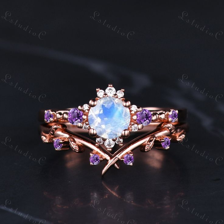 a ring with an opal and amethorate surrounded by purple sapphires