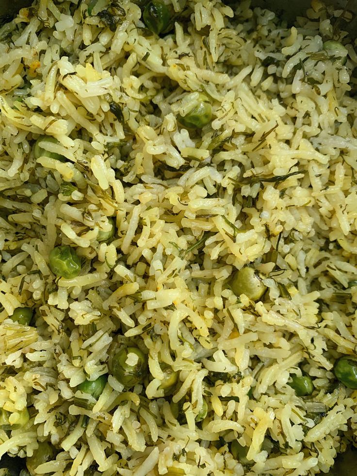 rice and peas are mixed together in a bowl