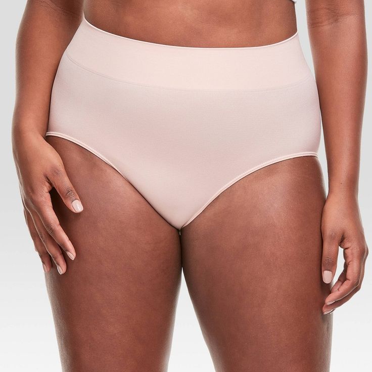 Give your curves every advantage with these Hanes® Premium seamless smoothing briefs. Crafted with incredibly soft fabric, these brief panties offer 4-way stretch that gently hugs your curves. The wide toning waistband provides comfortable smoothing for a seamless look under clothes. Perfect for wearing under outfits that require a little more coverage, the brief style gives you full front and seat coverage. A Tagless® interior means no scratchy tags to bunch up - a feature you're sure to apprec Shaping Briefs With Moderate Coverage, Shaping Briefs With Soft Touch, Compressive Brief Shapewear With Moderate Coverage, Supportive Solid Shapewear With Moderate Coverage, Compressive Shapewear Brief With Moderate Coverage, Compressive Moderate Coverage Shapewear Brief, Seamless Shaping Shapewear Briefs, Supportive Moderate Coverage Shapewear, Supportive Brief Shapewear With Moderate Coverage