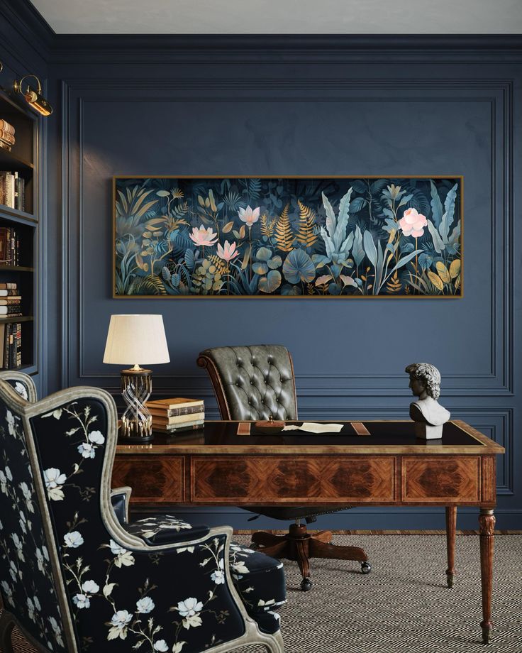 an office with blue walls and floral paintings on the wall, along with a leather chair