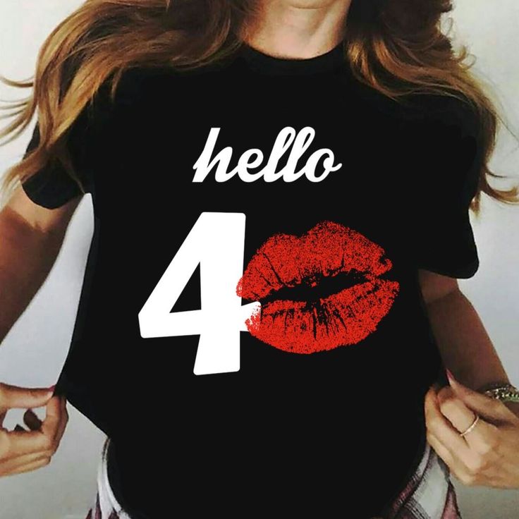 a woman wearing a t - shirt with the number four on it and her lips painted red