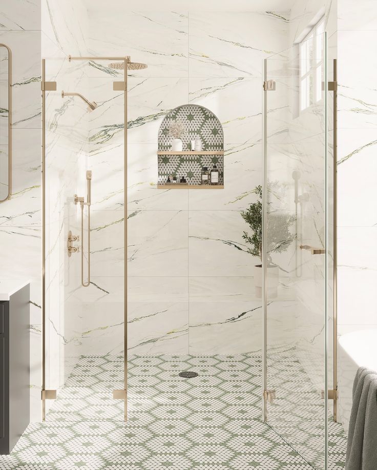 a bathroom with marble walls and flooring, including a walk - in shower next to a bathtub