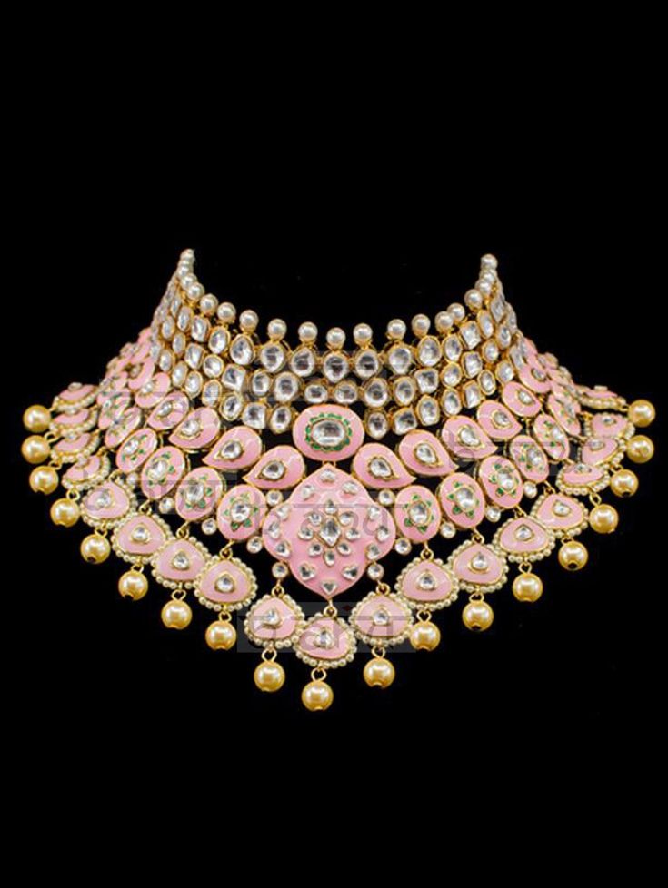 "Gulrukh Meenakari Bridal Set - Pink A pure hand-drawn detailed jewelry in the shades of soft pink and green meenakari work. This piece displays high-quality workmanship and fine usage of stones! This meenakari necklace set is perfect for western or traditional outfits. This set features a necklace with jadai detailing, featuring kundan chand motifs with lotus meenakari detailing. Delicate necklace accented with kundan stones and faux pearls creating a lush, sparkling set. The set includes a pai Ceremonial Temple Jewelry With Motifs, Round Kundan Necklace With Meenakari, Designer Chandbali Jewelry For Festivals, Designer Chandbali Jewelry For Festive Occasions, Designer Festive Chandbali Jewelry, Temple Jewelry With Motifs For Diwali, Ceremonial Kundan Jewelry With Motifs, Designer Meenakari Chandbali Jewelry, Ceremonial Jewelry With Chandbali Motifs