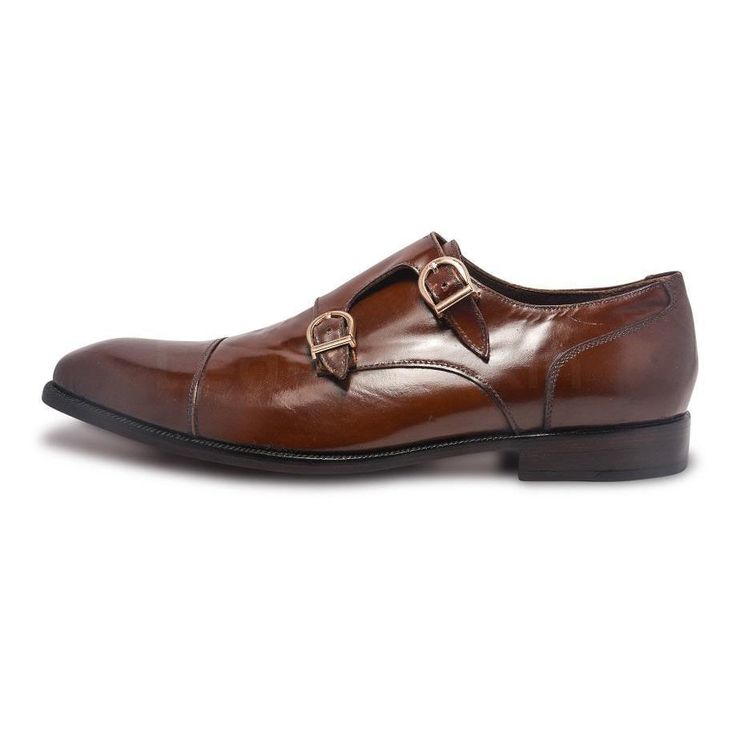 Shiny Double Monk Golden Buckle Leather Shoes with Capped Toe The perfect rich brown monkstrap leather shoes The high quality exterior with polished surface Extreme attention given to detailing while designing The monk style belt closure strap is quite practical The belt strap also has golden embellishment buckle The impeccable surface finish makes these shoes attractive A perfect fusion of sober elegant and traditional class Smooth slip-on shoes for an easy wear and comfort Choosing the right leather shoes can be tricky. To make this experience easier, we have brought these multi-purpose brown leather slip-ons. They are pretty amazing to make your overall outfit more stylish and trendy. Style Guide for Shiny Brown Leather Shoes A monk shoe doesn’t have lace system and that makes them high Elegant Bridle Leather Slip-on Monk Strap Shoes, Formal Brown Monk Strap Shoes With Round Toe, Luxury Monk Strap Shoes With Brogue Detailing For Office, Luxury Leather Slip-on Shoes With Buckle, Gold Leather Business Shoes, Brown Wingtip Monk Strap Shoes For Office, Gold Loafers With Leather Sole For Business, Luxury Slip-on Dress Shoes With Buckle Closure, Elegant Brown Monk Strap Shoes