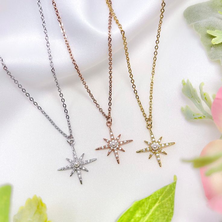 "This listing is for one rhodium, rose gold, or gold plated cubic zirconia faux pearl starburst charm necklace with adjustable/resizable stainless steel chain. Each charm has a brass base and plated with real rhodium, rose gold, or gold. The chains are tarnish-resistant stainless steel - the rose gold and gold chain options are plated with real rose gold or gold. The approximate dimensions of each charm are 0.75\" long x 0.75\" wide. The length of each necklace is 16.5\" with a 3.5\" extension, Bullet Shell Jewelry, Wolf Skull, Egyptian Necklace, Ankh Necklace, Bullet Shell, Queen Nefertiti, Star Charm Necklace, King Tut, Rose Quartz Necklace