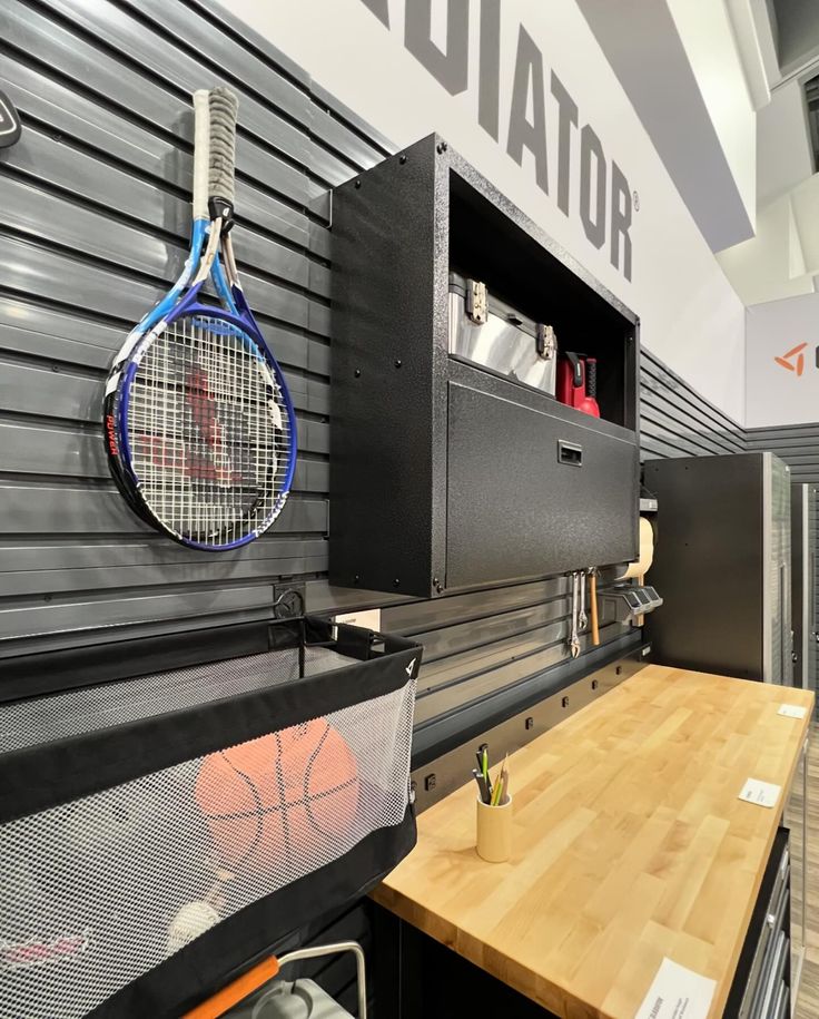 a tennis racket hanging on the wall next to a counter