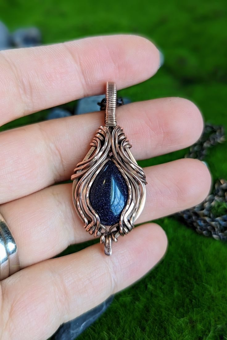 This is a handmade copper wire wrap necklace. For this necklace I wanted to try a more symmetrical design. I used copper wire around a blue goldstone cabochon and created a very beautiful fantasy looking pendant. Wire Wrap Necklace, Symmetrical Design, Wrap Necklace, Blue Goldstone, Wire Wrapped Necklace, Handmade Copper, Hand Made Jewelry, Wire Wrap, Copper Wire