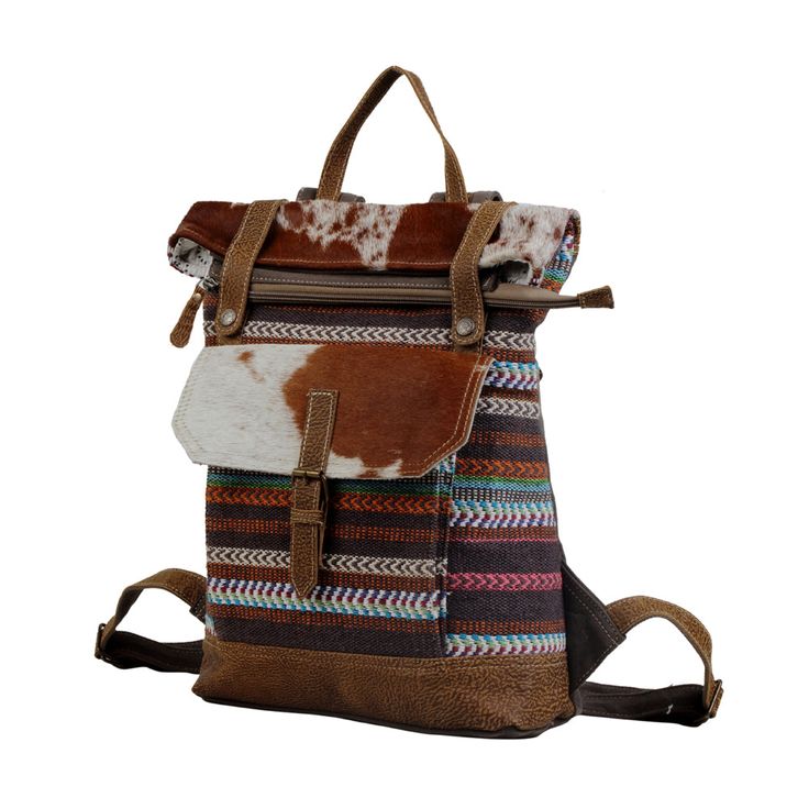 The Elley Backpack is sassy and fun. Made with up-cycled canvas, antique textiles, paired with genuine leather and real cow-hide making this bag a piece of art! Item Width 14.5 Item Depth 4.5 Item Height 19 Color Hide colors may vary Handle n/a Vintage Backpack With Leather Trim, Vintage Backpack For Trips, Retro Canvas Backpack For Everyday Use, Vintage Bags With Leather Patch For Daily Use, Multicolor Travel Bags With Leather Trim, Multicolor Leather Standard Backpack, Multicolor Leather Backpack, Bohemian Brown Backpack For Everyday, Everyday Brown Bohemian Backpack