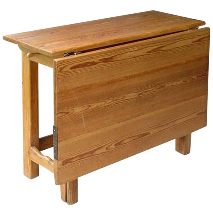 a wooden cabinet with two legs and a drawer on one side, in the shape of a chest