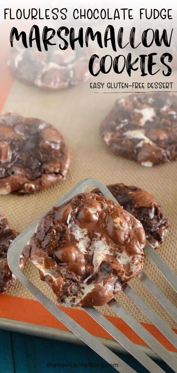 chocolate fudge marshmallow cookies on a cookie sheet with a fork in the foreground