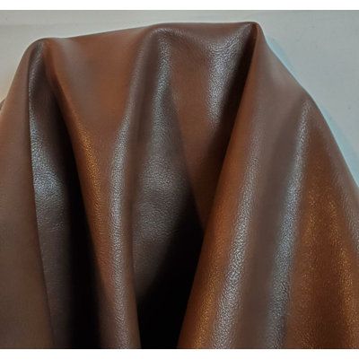 a close up view of a brown leather material that looks like it has been made out of