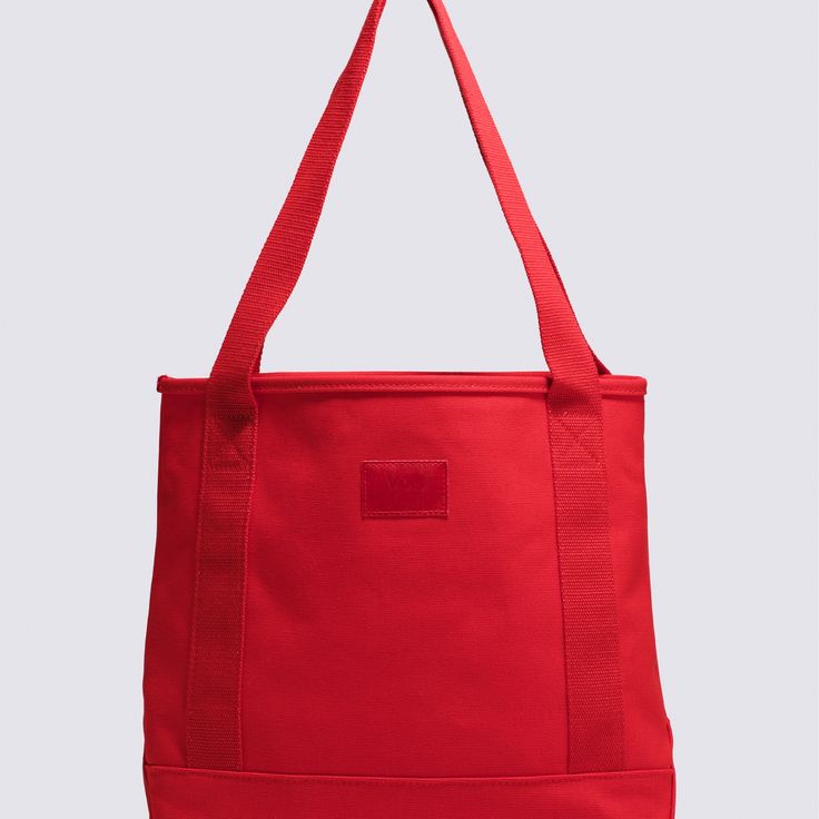 The Pergs Midi Tote Bag is a must have for stashing your essentials. Featuring a main compartment to store all your goods and web handles, this carry-all tote boldly stands out in eye-catching red. Shell: 100% Cotton fabric Interior hanging pocket Web handles Capacity: 8 Liters Dimensions: 12''w x 12''h x 5''d | Vans Pergs Midi Tote Bag