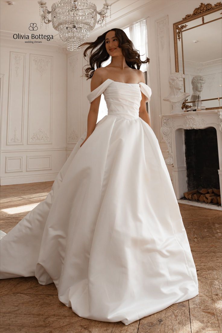 Off-the-shoulder boat neckline puff skirt satin romantic classy elegant wedding dress with long train Princess Balloon, Wedding Dress With Long Train, Dress With Long Train, Princess Balloons, Olivia Bottega, Puff Skirt, Satin Bridal Gowns, Skirt Satin, Satin Ball Gown