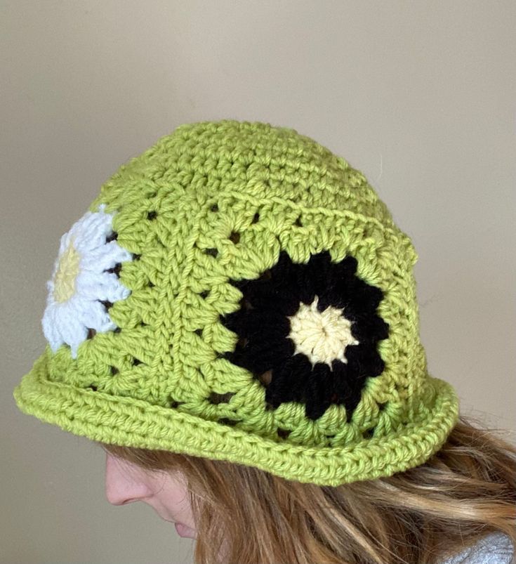 This handmade granny square crochet bucket hat is the perfect accessory to add a pop of color and style to any outfit. Made with care and attention to detail, each hat is crafted with a unique combination of colorful granny squares, creating a one-of-a-kind look. Whether you're running errands, lounging by the pool, or attending a music festival, this versatile hat is the perfect addition to your wardrobe. Care Instructions: Machine washable in cold water. Gentle cycle recommended. Lay flat to d Vintage Crochet Beanie Hat For Spring, Trendy Handmade Green Crochet Hat, Handmade Retro Crochet Hat For Winter, Retro Handmade Crochet Hat For Winter, Retro Spring Crochet Hat, Retro Spring Crochet Hat, One Size, Retro Crochet Hat For Spring, One Size, Trendy Green Crochet Hat With Adjustable Fit, Handmade Green Crochet Hat, Casual Style