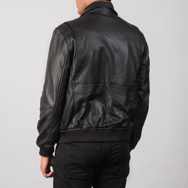 Introducing the ultimate in classic style and modern comfort: the Men's Black A2 Leather Bomber Jacket. Crafted from the highest quality leather and designed with both fashion and function in mind, this jacket is the perfect addition to any wardrobe. With its sleek black exterior and timeless design, this bomber jacket is a true fashion staple. The sturdy construction ensures durability and longevity, while the soft and supple leather provides unbeatable comfort and style. The ribbed collar, cuf Leather Motorcycle Jacket Women, Mens Leather Jacket Vintage, Leather Trench Coat Woman, Trucker Jacket Men, Man Cafe, Leather Jacket For Men, Shearling Jacket Women, Motorcycle Jacket Women, Cafe Racer Jacket