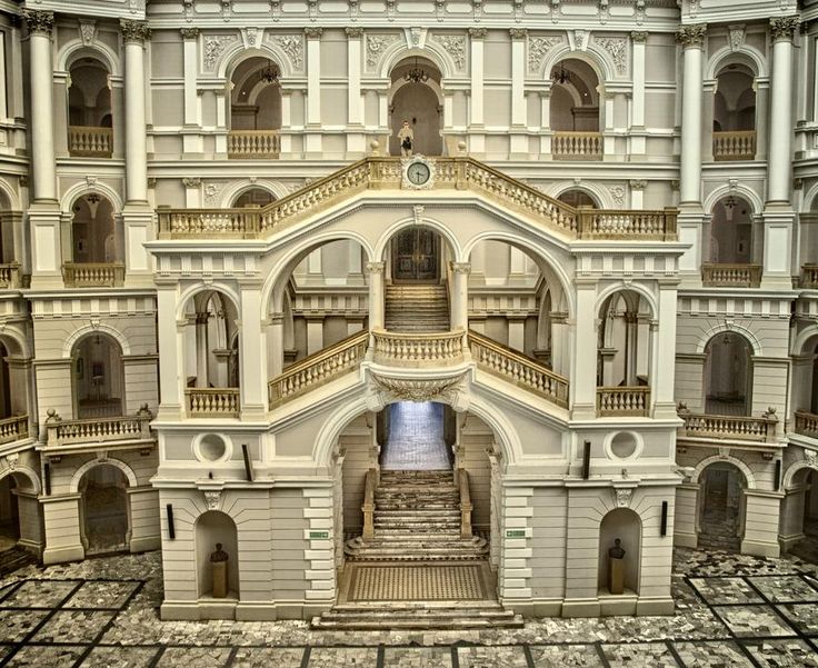 an architectural model of a large building with stairs and balconies on the second floor