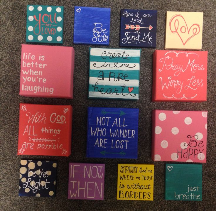 many different types of painted blocks with words and phrases on them, all in bright colors