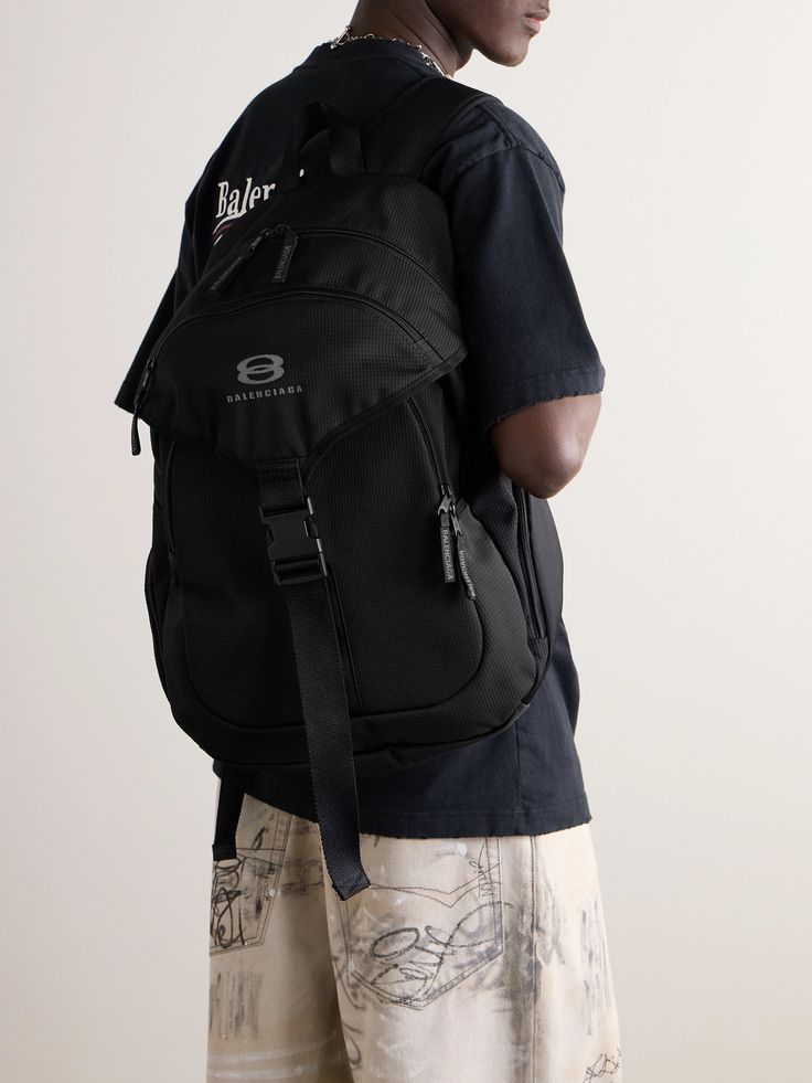 Balenciaga's backpack takes cues from practical hiking styles. It's been made in Italy from durable water-repellent ripstop and embroidered with the brand's 'Unity Sports' logo. It's generously sized to hold a tablet, water bottle and paperback and boasts a host of pockets for keeping the essentials organised. Tom Ford Bag, Balenciaga Backpack, Balenciaga Logo, Hiking Fashion, Wardrobe Edit, Luxury Sneakers, Stylish Watches, Loungewear Shorts, Classic Sneakers