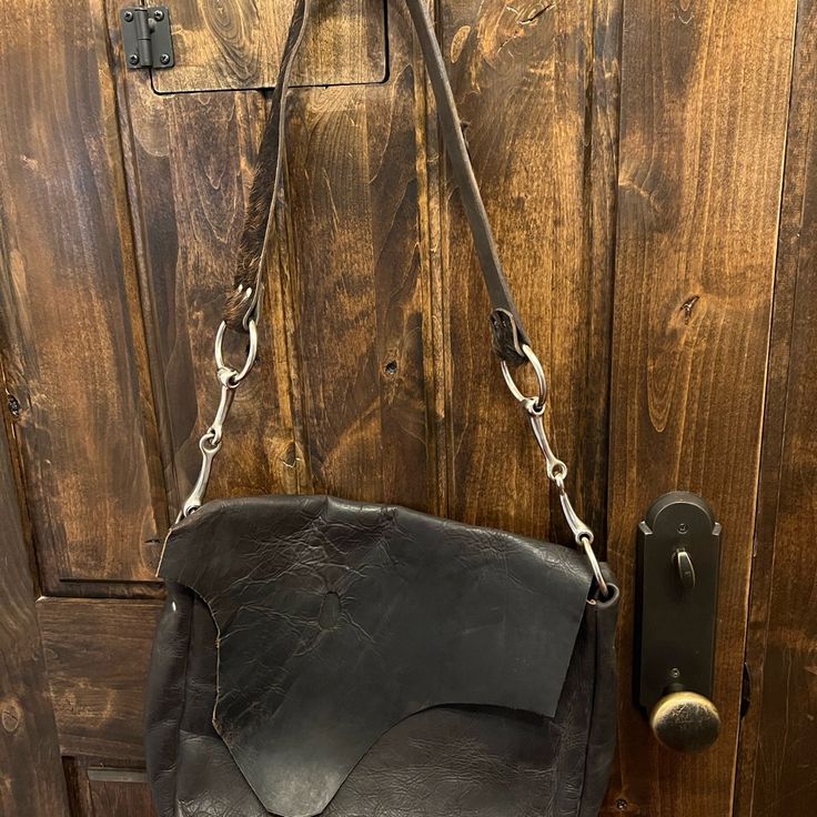 Luke And Lyla Black Leather Bag With Cowhide Strap. The Hole In The Leather On The Flap Was Made That Way. This Bag Was Only Carried A Few Times. Looks Brand New. Black Leather Bag, Black Leather Bags, Womens Tote Bags, That Way, Leather Bag, Black Leather, Wallet, Brand New, Leather