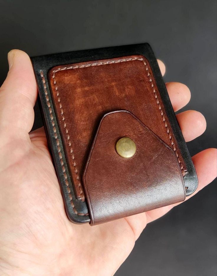 Discover the perfect blend of style and functionality with this handmade leather wallet. Crafted from high-quality, durable leather, this minimalist bifold wallet is designed to keep your essentials organized without the bulk. The rich brown color and vintage finish give it a timeless appeal, while the contrasting black edges add a modern touch.  This wallet features a spacious card holder and a secure coin pocket with a brass snap closure, ensuring your valuables are safely stored. Ideal for th Brown Rectangular Wallet With Waxed Finish, Modern Leather Trifold Wallet, Minimalist Leather Trifold Wallet, Leather Trifold Wallet With Card Slots For Everyday, Minimalist Leather Trifold Wallet With Card Slots, Minimalist Leather Trifold Wallet With Interior Card Slots, Handmade Leather Wallets For Everyday Carry, Brown Rectangular Trifold Wallet With Waxed Finish, Bifold Waxed Finish Wallets For Everyday Carry