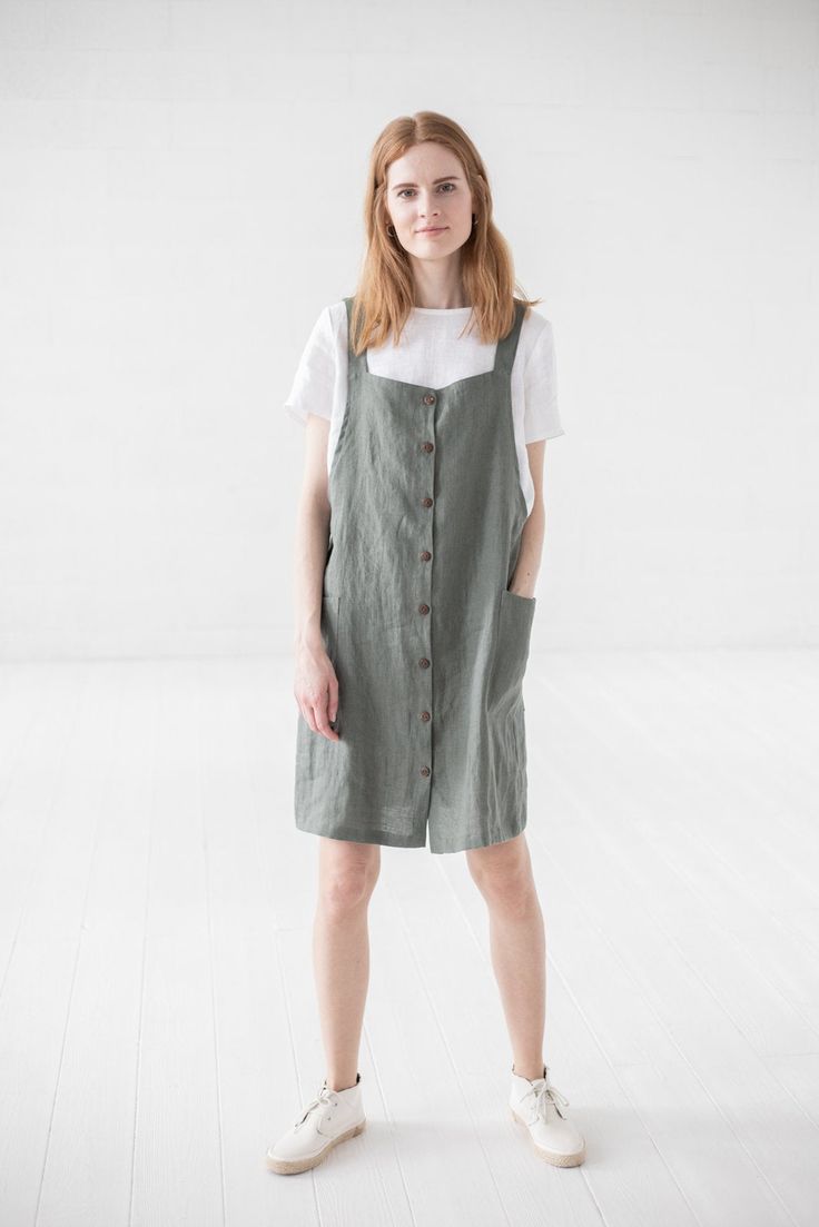 "DETAILS * Short pinafore dress with two deep pockets at the front * Functional down buttons at the front * Combine with all style blouses * Made from soft wash medium weight (185 g) 100 % European linen fabric * Height of the model is 177 cm (5' 8\") and she is wearing dress in size XS/S and sage green color * The full dress length is 93 cm / 36.6'' * Please choose desired color and size on the right * Product number: D16 CARE LABEL * machine wash gentle (40 C/104 F) * dry gentle on low heat * Everyday Summer Dresses With Buttons, Casual Fall Pinafore Dress For Workwear, Casual Pinafore Dress For Work, Button-up Summer Dress For Everyday, Knee-length Pinafore Dress With Pockets, Everyday Summer Button-up Dresses, Everyday Button-up Summer Dress, Spring Workwear Pinafore Dress With Pockets, Spring Pinafore Dress With Pockets For Work