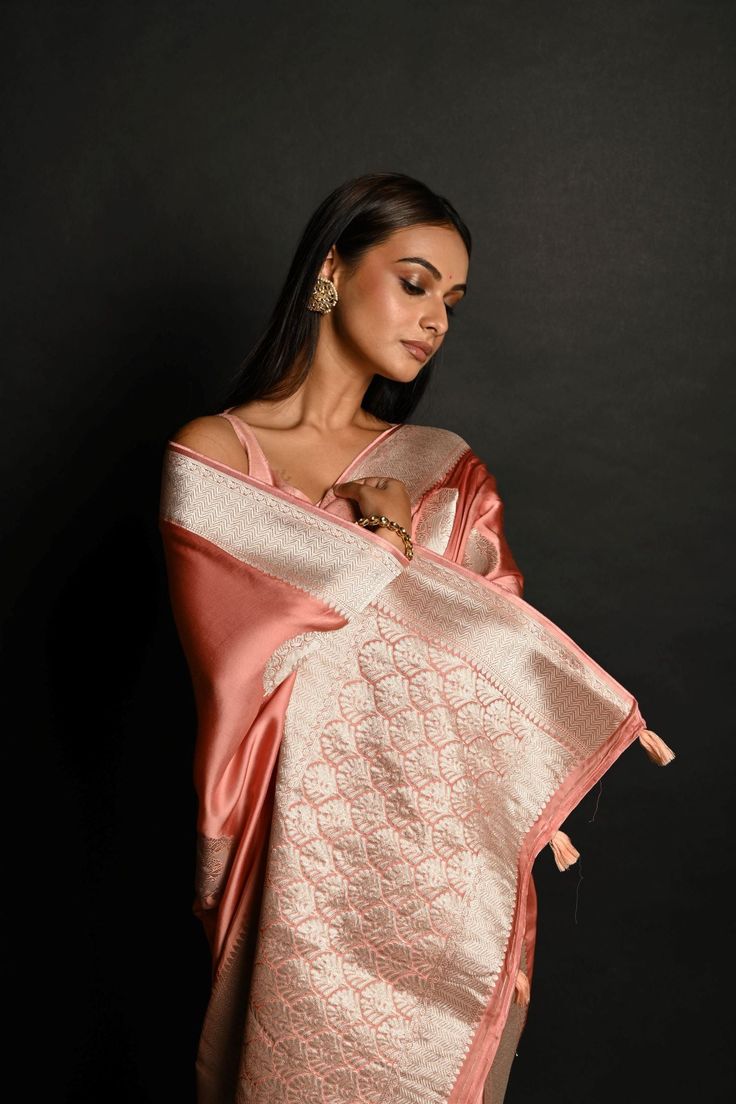 Discover refined elegance with our Powder Pink Pure Handloom Banarasi Silk Saree, featuring a delicate silver Zari weave. Crafted from luxurious satin silk, this saree exudes timeless charm and sophistication, perfect for any special occasion. Elegant Banarasi Silk Pre-draped Saree For Formal Occasions, Elegant Formal Banarasi Silk Pre-draped Saree, Elegant Art Silk Pre-draped Saree For Traditional Ceremonies, Elegant Katan Silk Pre-draped Saree With Self Design, Elegant Semi-stitched Satin Saree, Elegant Unstitched Satin Saree, Formal Satin Saree With Zari Work, Elegant Satin Blouse With Dupatta, Traditional Pre-draped Satin Saree With Cutdana