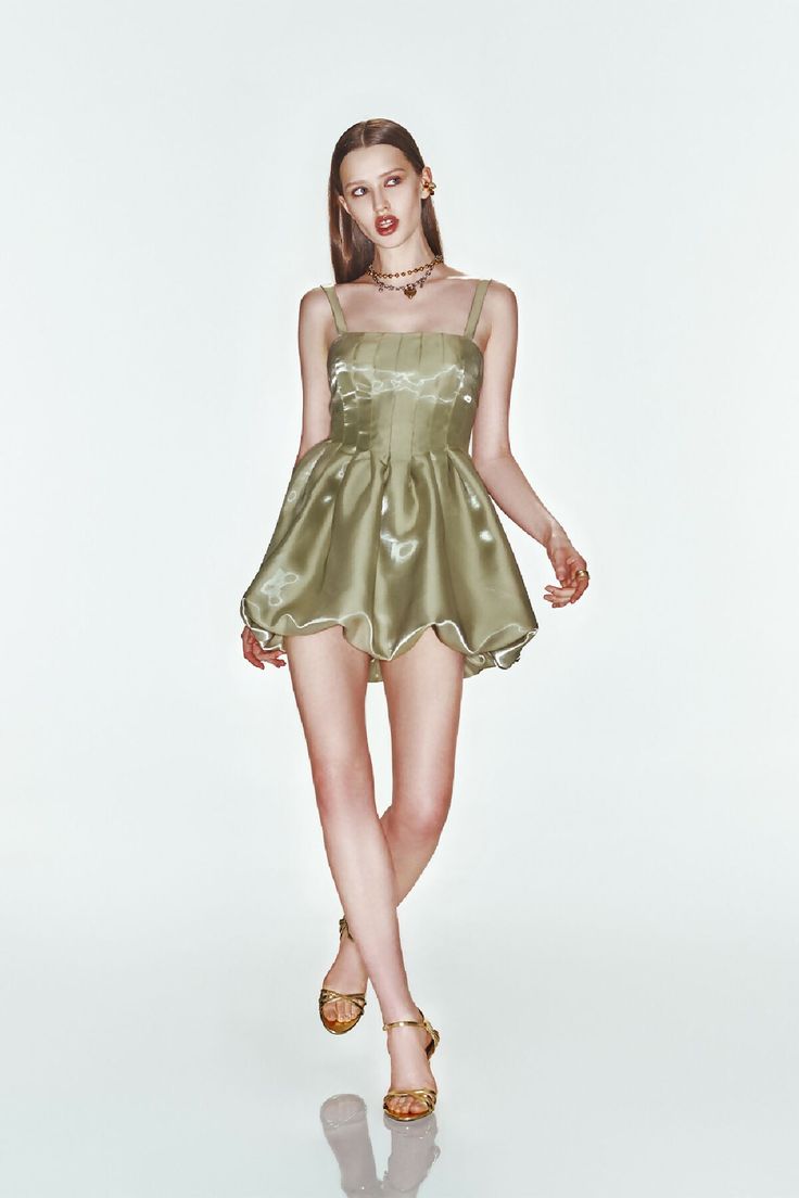 Crafted from reflective glossy fabric, our balloon dress features a corset like bodice, exuding elegance. Fitted bodice with pleats Strapless design with adjustable straps Voluminous balloon skirt Reflective glossy fabric Hidden zipper closure at the back Materials: 100% polyester Color: Sea Moss Made in Turkey. Model Measurements: Height 180 cm Bust 83 cm Waist 62 cm Hips 91 cm Model Size: S Party Corset With Spaghetti Straps And Ruched Detail, Sleeveless Ruched Bodice Corset For Party, Spaghetti Strap Corset Dress With Pleated Bodice For Cocktail, Party Corset With Ruched Bodice, Summer Cocktail Corset With Ruched Bodice, Party Overbust Corset With Ruched Bodice, Party Corset With Pleated Fitted Bodice, Party Corset Dress With Spaghetti Straps And Ruched Bodice, Glamorous Corset Dress With Ruched Bodice