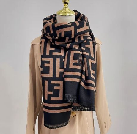 Introducing the Freya Scarf, a stylish accessory that seamlessly marries form and function. With its contemporary geometric patterns and cozy warmth, scarf is not just a fashion statement but also a practical layer for chilly days, ensuring you stay chic and snug throughout the season. Measurement: 74" x 25" Fabric Content: Polyester Trendy Beige Winter Scarf, Trendy Beige Scarf For Winter, Chic Beige Winter Shawl, Chic Beige Fall Scarves, Chic Beige Scarves For Fall, Chic Beige Scarf For Fall, Trendy Winter Scarves One Size, Trendy One Size Winter Scarves, Chic Winter Scarves One Size