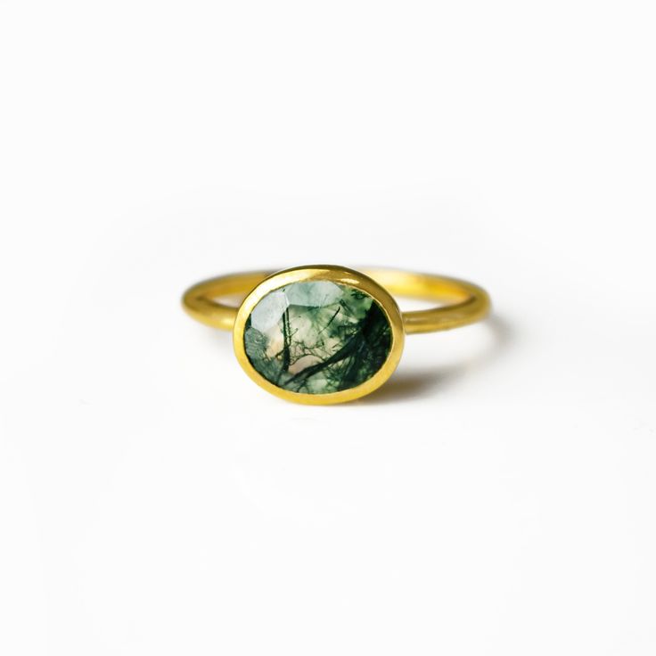 You'll fall in love with the stunning natural green veining of this oval cut Moss Agate ring. This is a perfectly sized oval ring to compliment any collection. Popular as a birthday gift, or for harmony seekers and moss agate lovers alike. This is a light, transparent gemstone with natural green mossy variations. This stone is beautifully faceted and bezel set in a 925 sterling silver band or plated with 18k vermeil gold.  Gemstone is approximately 8 x 12mm. Band has 925 stamp on inside. Please Oval Moss Agate Gemstone Ring, Oval Moss Agate Ring For Anniversary, Green Oval Opal Ring, Green Moss Agate Gemstone Ring, Handmade Oval Emerald Ring, Oval Cabochon Emerald Ring Gift, Oval Emerald Ring Gift, Oval Green Opal Gemstone Ring, Handmade Oval Moss Agate Ring