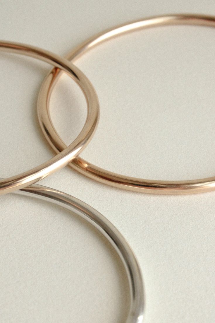 The Georgia is a timeless, minimalist bracelet style with an organic oval shape designed for constant wear. It is comfortable enough to wear even while sleeping, yet strong enough to gracefully withstand years of daily use. Each hand-soldered bracelet is shaped to mimic the contours of your forearm. Available in durable 14k gold fill, solid sterling silver, and solid 14k gold. These materials are water resistant and low maintenance. For more information, visit our Metals Encyclopedia. ✦ SIZING ( Modern Everyday Oyster Bracelet, Sleek Polished Bangle Jewelry, Sleek Polished Bangle Bracelet, Modern Hoop Bangle For Everyday Wear, Modern Hoop Bangle For Everyday, Sleek Round Band Jewelry For Everyday, Sleek Everyday Round Band Jewelry, Modern Adjustable Oval Bangle, Minimalist White Gold Cuff Bracelet With Polished Finish