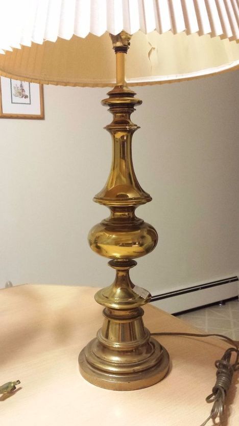 a lamp sitting on top of a wooden table