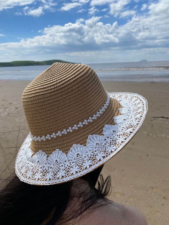 Unique design handcrafted summer hat with embroidered lace detailing. Hat dimensions: one size, adjustable, brim 7cm Bohemian Hat With Crochet Trim, Spring Sun Hat With Crochet Trim And Curved Brim, Summer Hats With Crochet Trim, Bohemian Cream Panama Hat For Beach, Cream Bohemian Panama Hat For The Beach, Cream Bohemian Panama Hat For Beach, Bohemian Adjustable Crochet Hat With Crochet Trim, Adjustable Bohemian Crochet Hat With Crochet Trim, Spring Beach Sun Hat With Crochet Trim