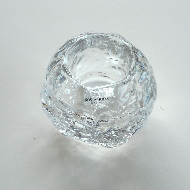 a clear glass bowl sitting on top of a table