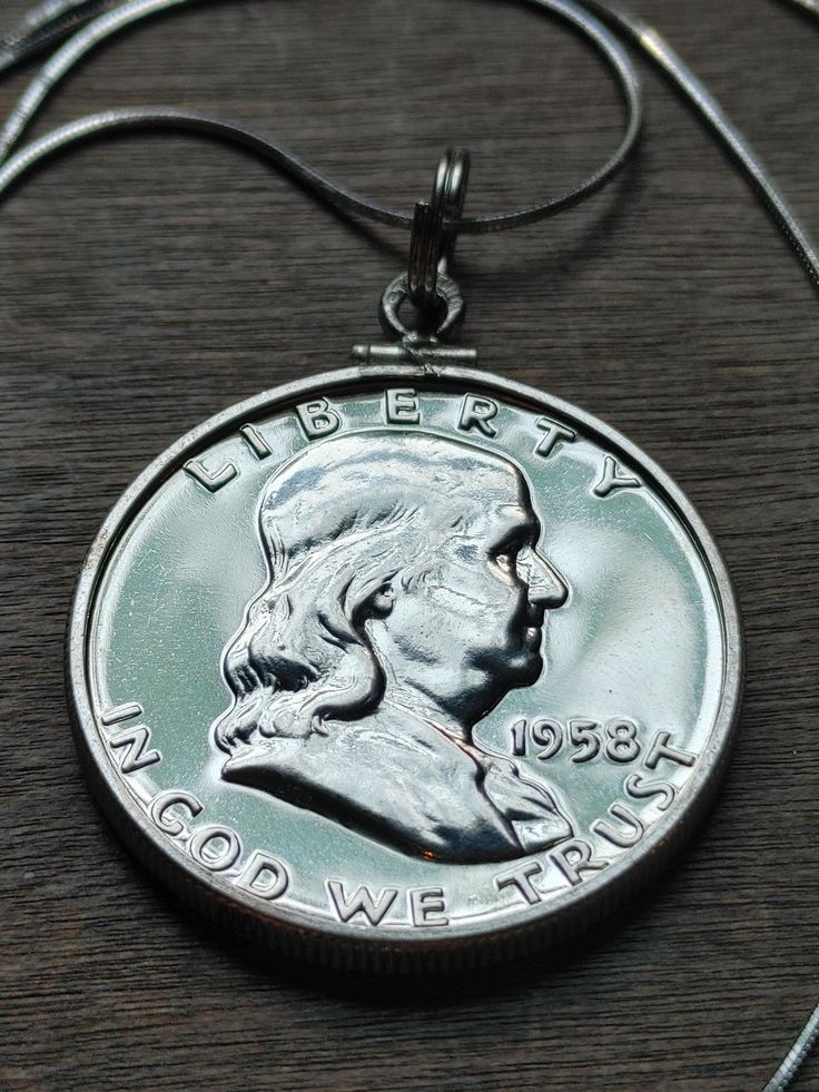 Silver Proof 1958 Benjamin Franklin Coin pendant. scarce high grade details touch of Polish beautiful all around excellent Liberty Bell details and well struck in every way.  set in sterling silver with an Italian sterling silver snake chain included.  This high grade coin will also include a COA from our shop as well as a high quality gift box Classic Silver Jewelry With Hallmark, Liberty Bell, Coin Pendant Necklace, Silver Snake Chain, Benjamin Franklin, Coin Necklace, Coin Pendant, Sterling Silver Chain, Snake Chain