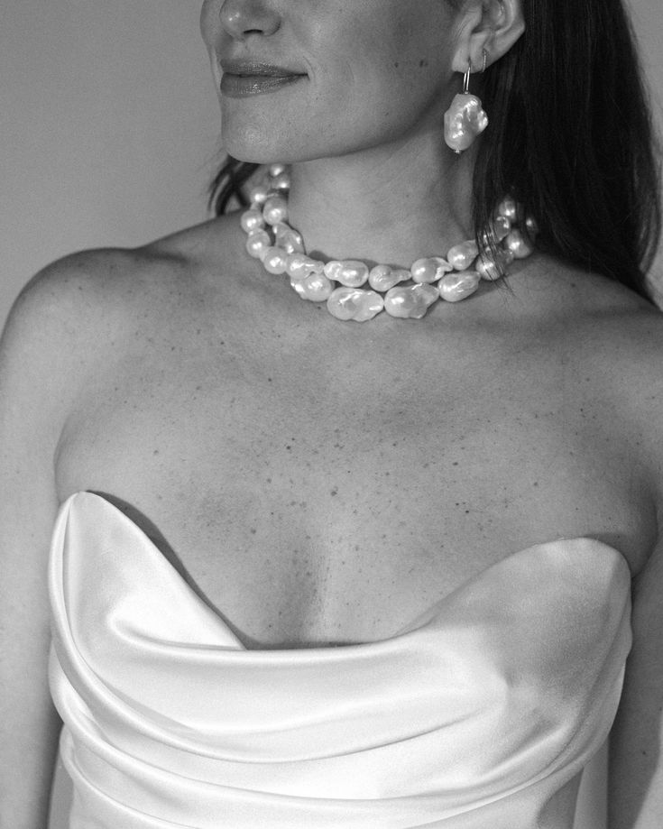 Shop our extra large white baroque freshwater pearl beaded necklace. Make a statement in this timeless twist on the classic pearl necklace. See the last photo to compare sizes between the Classic and Chunky Baroque Pearl Necklaces. Details: - Gold plated silver - Length: 15", Extender 3" - Pearls are natural; variations occur per necklace - Pearl direction varies White Baroque Pearl Necklace For Party, Luxury Baroque Pearl Jewelry For Party, Party Pearl Necklace With Baroque Pearl Pendant, Party Jewelry In Pearl White Baroque Pearl, Party Jewelry In Pearl White With Baroque Pearls, Party Jewelry With Baroque Pearls In Pearl White, Party Baroque Pearl Jewelry In Pearl White, Baroque Pearl Necklace With Pearl Charm For Party, Elegant Baroque Pearl Necklace With High Luster