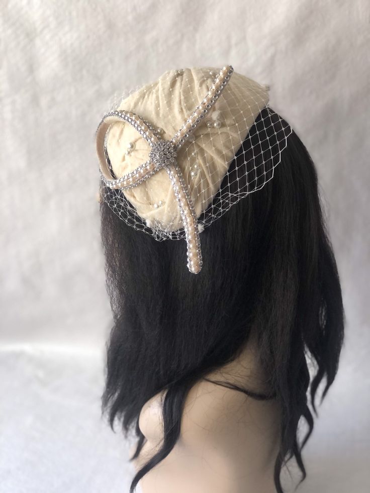 This is a classy vintage inspired 1950s - 1960s Ivory, Cream or Ecru felt half hat with a modern touch perfect as a bridal fascinator hat, wedding hat, tea party hat, church hat or any other special occasion. This is a Ivory felt headpiece create by hand and has a wire base that can fit any head size comfortably. WHAT MAKES THIS SO UNIQUE I form each piece while on my head to see how it fits and looks and then take it off and hand sew each piece. I design it to wear both ways so there's no front White Church Hats, Mother Of The Bride Hats, Ivory Fascinator, Green Fascinator, Hat Tea Party, Red Fascinator, Bridal Fascinator, Women Church, Beige Wedding