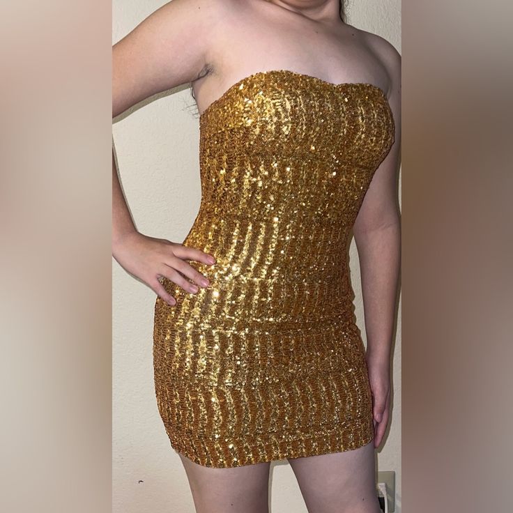 New With Tags Several Sizes Available Junior Sizing Gold Sequins Fully Lined Mini Dress What You See Is What You Get , Overstock Prices All Sales Final Gold Sequin Mini Dress For Evening, Gold Sequined Strapless Mini Dress, Gold Strapless Mini Dress With Sequins, Gold Strapless Sequin Mini Dress, Gold Strapless Fitted Sequin Dress, Gold Sequin Mini Dress For Night Out, Gold Sleeveless Mini Dress For Date Night, Sleeveless Gold Mini Dress For Date Night, Gold Mini Length Sequin Dress For Night Out