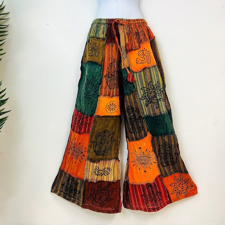 Cotton Patchwork Wide-leg Pants, Hippie Wide Leg Patchwork Pants, Hippie Wide-leg Patchwork Pants, Festival Patchwork Wide Leg Bottoms, Wide Leg Patchwork Bottoms For Festival, Multicolor Full-length Wide Leg Pants With Pockets, Orange Full-length Cotton Bottoms, Orange Full Length Cotton Bottoms, Multicolor Cotton Wide Leg Pants With Pockets