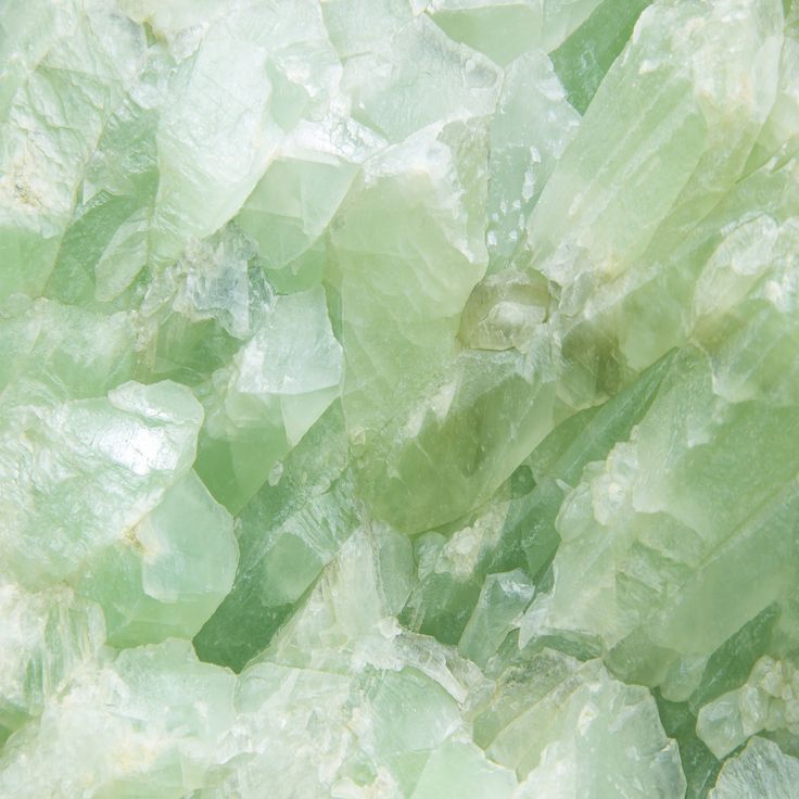 green and white crystals are stacked together