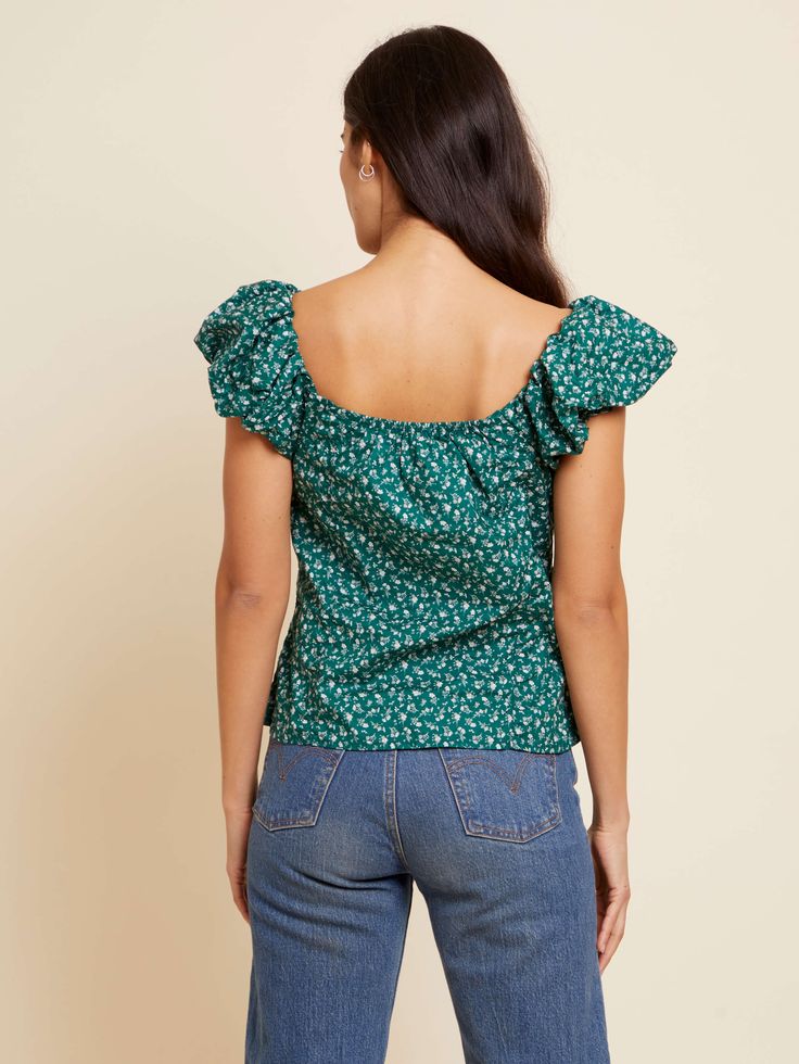 The name says it all. With a sweetheart neckline, buttons down the front and a cute bubble sleeve, it’s just the girly touch your outfit needs. (This one comes in Emerald Floral.) Outfit Needs, Angel Top, Nation Ltd, Bubble Sleeve, Your Outfit, Feminine Style, Sweetheart Neckline, Short Sleeves Tops, Button Downs