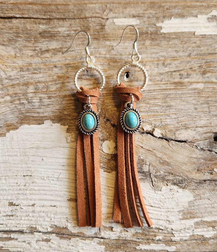 Leather earrings , western fringe turquoise charm earrings..  are  3 inches in length,  deerskin leather earrings... * Processing time is 1-2 days. *   If you are unhappy with your purchase for any       reason. Please message me & we will work       something out. Custom orders can not be returned.       However, contact me & we will discuss an alternate       plan to make everyone happy. :) *    https://www.etsy.com/shop/PiercedLeather Leather Earrings - Concho - Western - Southwestern - Fringe - Rodeo - Cowgirl - Rustic - Handmade - Pierced Leather - Best Friend GiftBoho Cheap Adjustable Western Style Earrings, Western Leather Earrings, Custom Cowboy Hats, Rodeo Jewelry, Earrings Western, Metal Jewelry Making, Diy Leather Earrings, Boho Earring, Country Jewelry