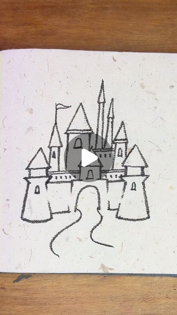 a drawing of a castle is shown on a piece of paper that has been drawn