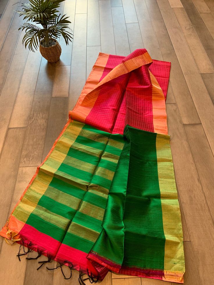 This is a very elegant, silk mark certified jute silk saree that hives a very polished and stylish look. What a great addition to your closet! The pallu is a beautiful contrast and blouse piece is the same color as pallu. Pallu has zari work and border comes with a zari patta. Falls/pico/blouse stitching can be done at an additional price.  Tassels are done. Multicolor Handloom Tissue Silk Saree, Multicolor Slub Silk Saree With Weaving Work, Green Slub Silk Saree With Weaving Work, Multicolor Cotton Silk Blouse Piece With Weaving Work, Jute Silk Saree, Temple Decor, Blouse Stitching, Zari Work, Blouse Piece