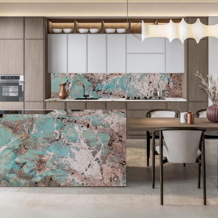 a modern kitchen with marble counter tops and white chairs in front of an island table