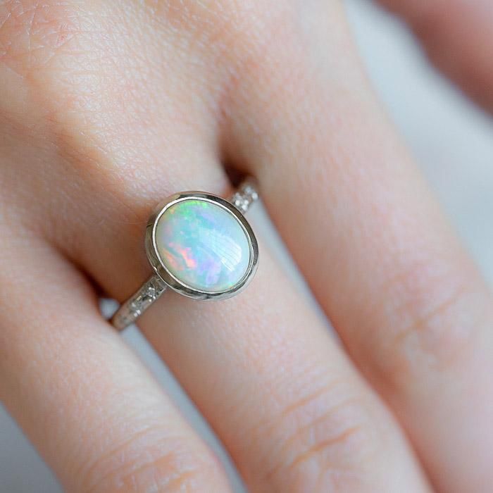 Our Twilight Ring has been set with a crystal opal and G/VS diamonds star set into the band. Opals are the birthstone of October. Opal measures 9 x 7mm. Total diamond weight 0.03ct. Band width 2.2mm. Pictured here with a high shine finish. For a matte finish please leave a note at checkout. Please note, we will match the opal as close to the image as possible. Each opal is unique and may vary in appearance and colour from what is depicted on the site. Classic Opal Rings With Birthstone, Classic Ethiopian Opal Gemstone Rings, Hallmarked Oval Diamond Opal Ring, Classic Round Cut Opal Birthstone Ring, Oval Yellow Gold Opal Ring In Sterling Silver, Oval Opal Rings With Bezel Setting, Yellow Gold Oval Opal Ring In Sterling Silver, Ethiopian Opal Gemstone Ring For Anniversary, Opal Birthstone Ring Oval Cabochon