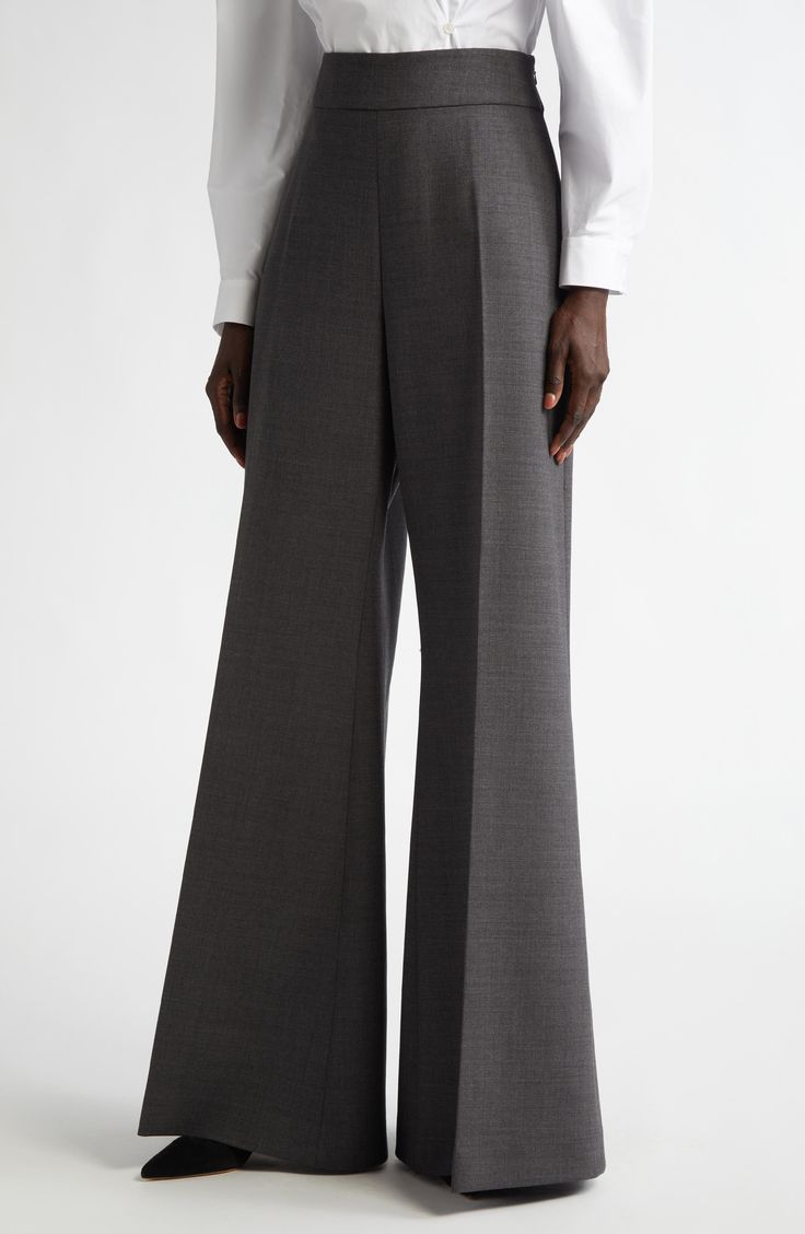 Wes Gordon's sophisticated sensibilities shine through the rich stretch-wool craftsmanship and pooling wide-leg silhouette of these Italian-made trousers. 34 1/2" inseam; 38" leg opening; 13" front rise; 14 1/2" back rise (size 10) Hidden side-zip closure Dry clean 97% virgin wool, 3% elastane Made in Italy Hispanic & Latinx Owned/Founded Formal Wide Leg Full Length Pants For Fall, Formal Fall Full Length Wide Leg Pants, Luxury High-waisted Wool Wide Leg Pants, Elegant Wide Leg Wool Bottoms, Tailored Flare Dress Pants For Formal Occasions, Modern Wool Wide Leg Dress Pants, Luxury Wool High-waisted Wide Leg Pants, Modern Wool Wide-leg Dress Pants, Elegant Flare Bottoms With Pressed Crease