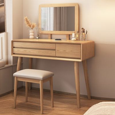 a bedroom scene with focus on the dressing table and stool, along with a window