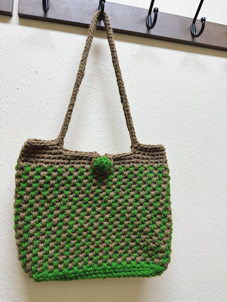 It is a double color crochet shoulder bag. It will be a great gift. Green Crochet Tote Straw Bag, Green Crochet Straw Tote Bag, Green Square Crochet Bag For Gift, Green Square Crochet Bag As Gift, Green Casual Crochet Bag Hand Knitted, Casual Green Hand Knitted Crochet Bag, Casual Green Hand-knitted Crochet Bag, Casual Green Crochet Bag, Green Hand Knitted Bags For Daily Use