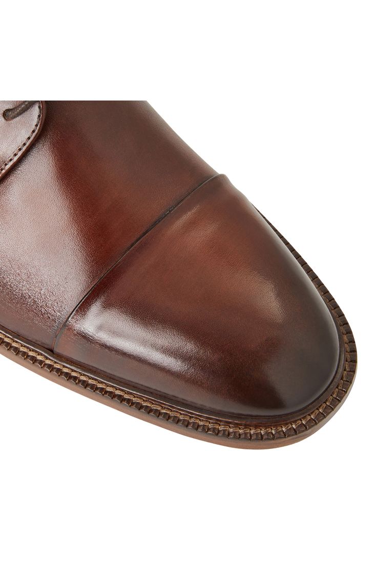 This cap-toe derby is cut from premium Italian leather. Lace-up style Leather upper and lining/leather and rubber sole Made in Italy Timeless Cap Toe Dress Shoes For Derby, Brown Goodyear Welted Derby For Business Casual, Classic Brown Dress Shoes With Rubber Heel Cap, Brown Dress Shoes With Rubber Heel Cap For Derby, Cap Toe Dress Shoes With Goodyear Welt For Derby, Timeless Derby Shoes With Goodyear Welt Construction, Classic Cap Toe Derby With Goodyear Welt, Cap Toe Goodyear Welted Derby For Workwear, Timeless Cap Toe Leather Shoes With Goodyear Welt