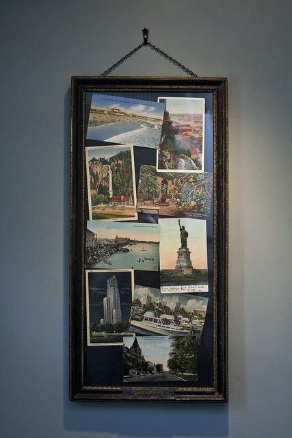 a wall hanging with many pictures on it